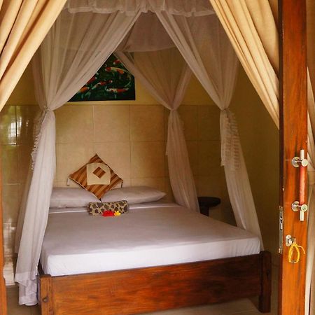 Rumahku Homestay Amed Esterno foto